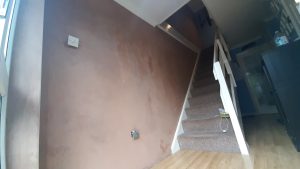 Hallway with plastered wall